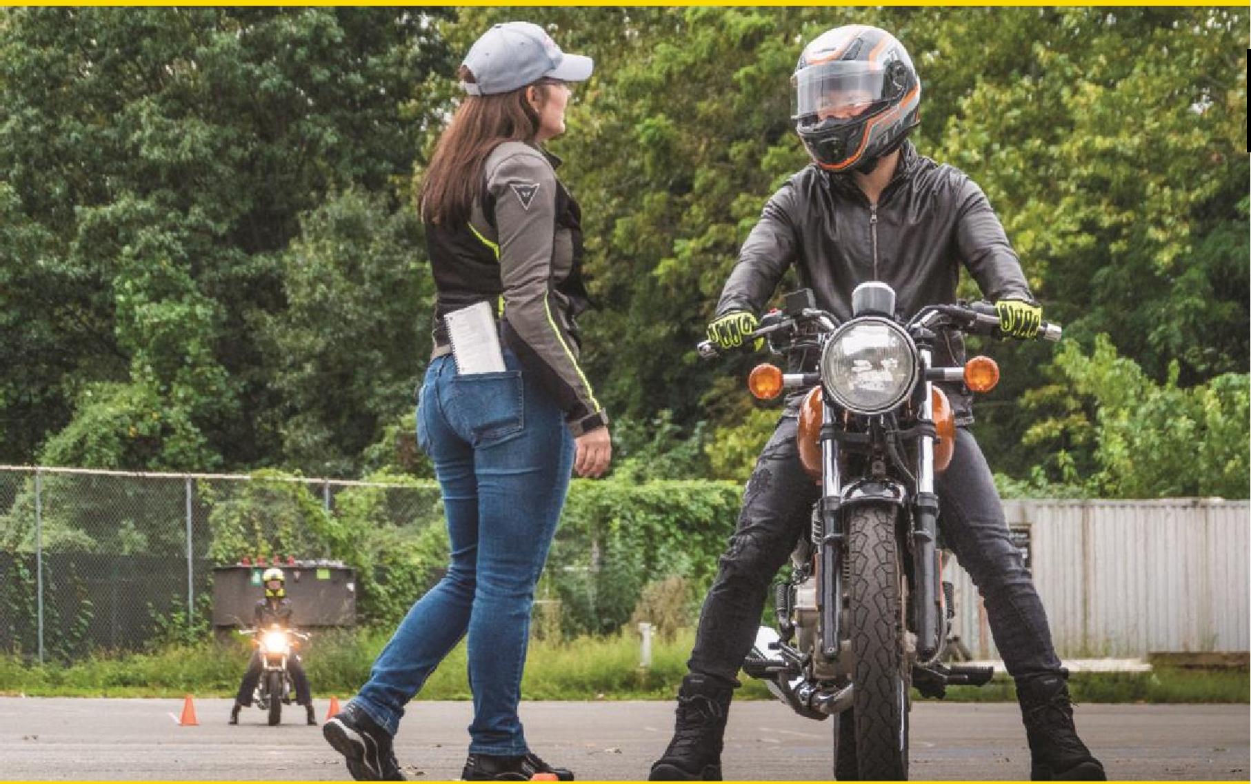Image of a lady talking to a man on a motorcycle