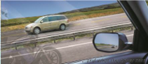 Image of a ghost motorcycle riding in the lane next to a vehicle